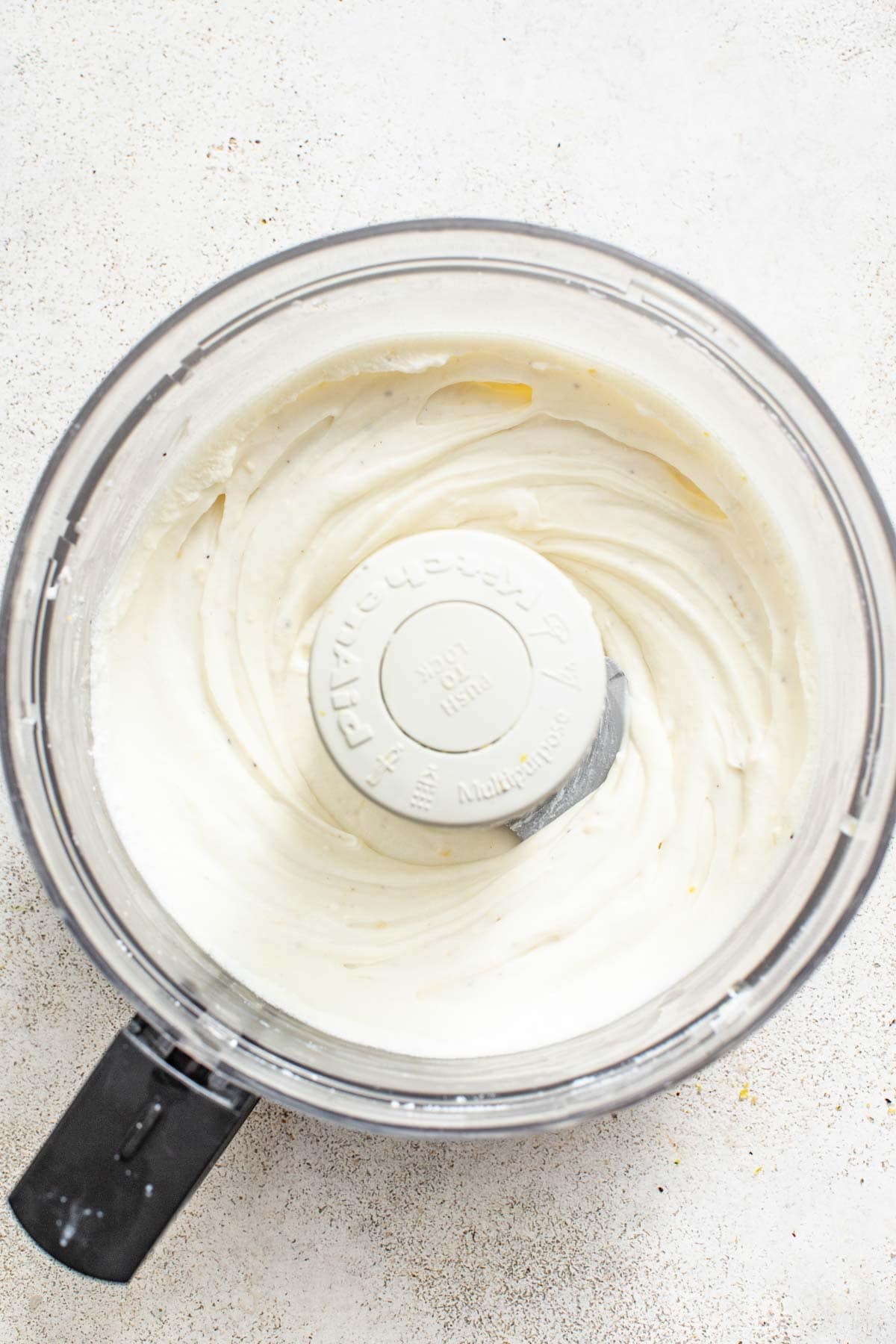 Smooth ricotta blended in a food processor.