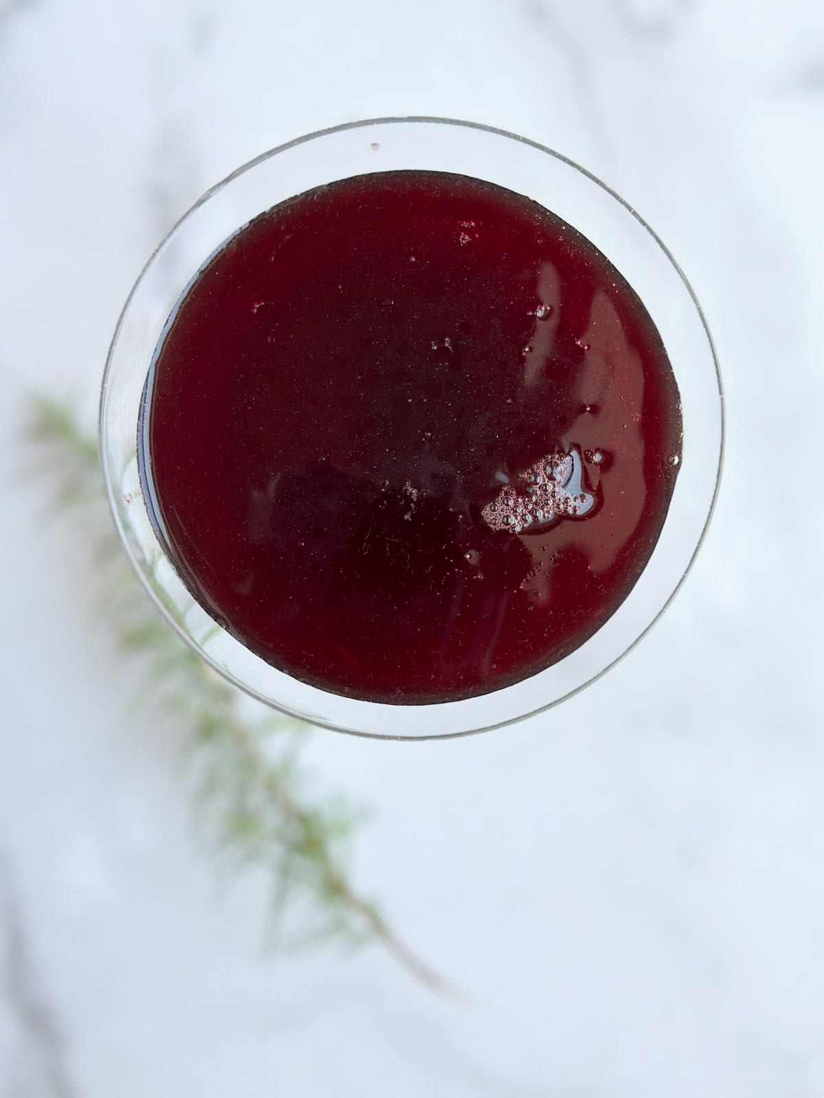 Tart cherry juice after being strained and poured into a glass.