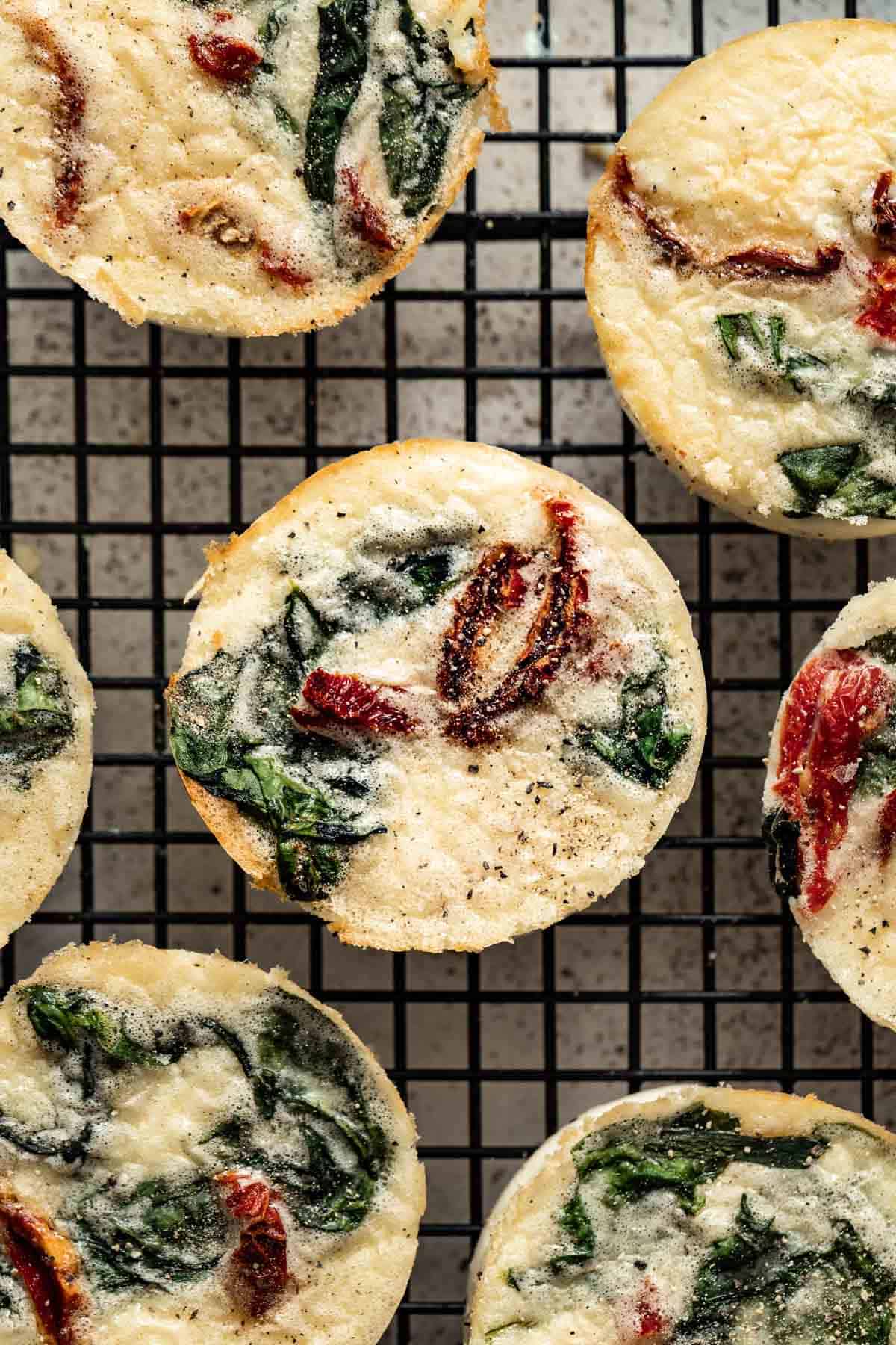 Egg bites cooling on a wire rack.