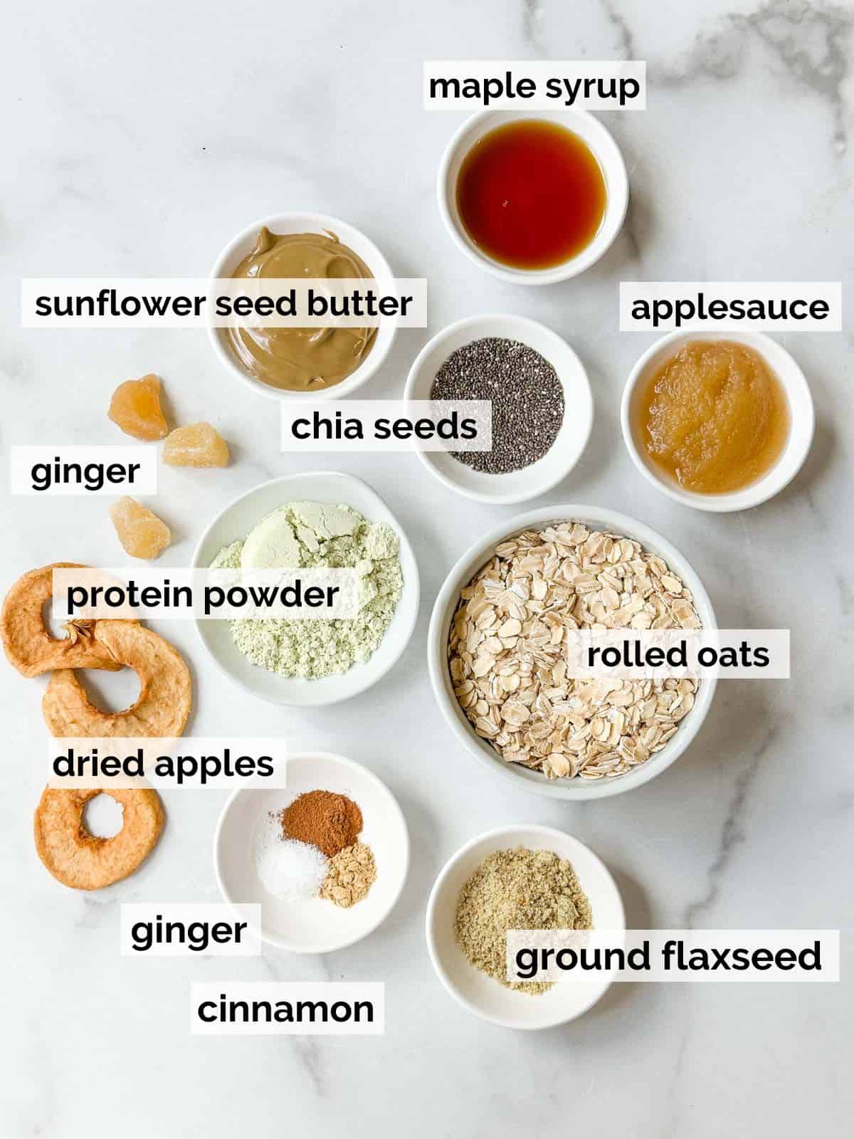 Ingredients for oatmeal protein balls with apples and ginger on a white background.