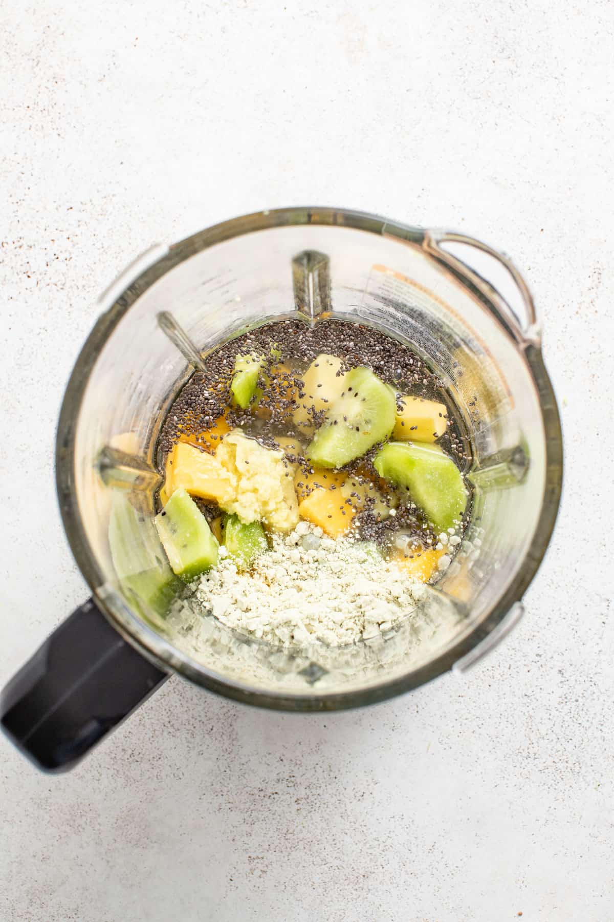 Mango and ginger in a blender.