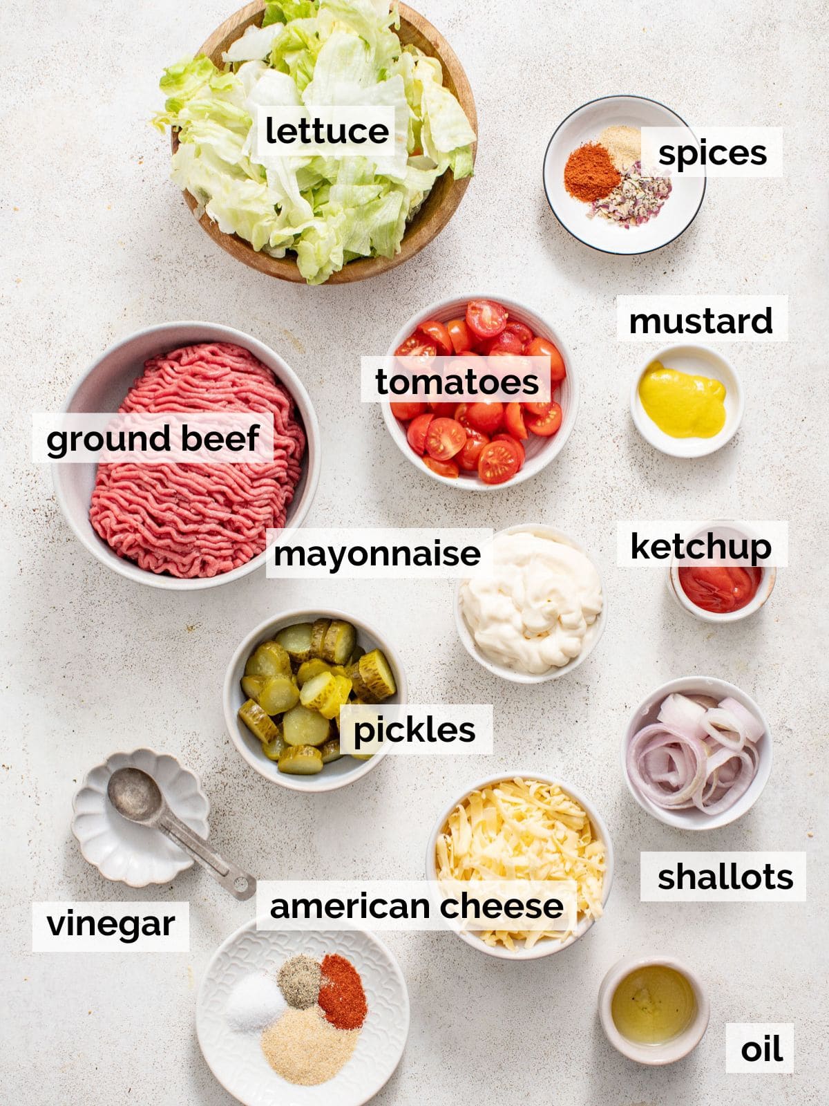Ingredients for burger bowls on a white background.