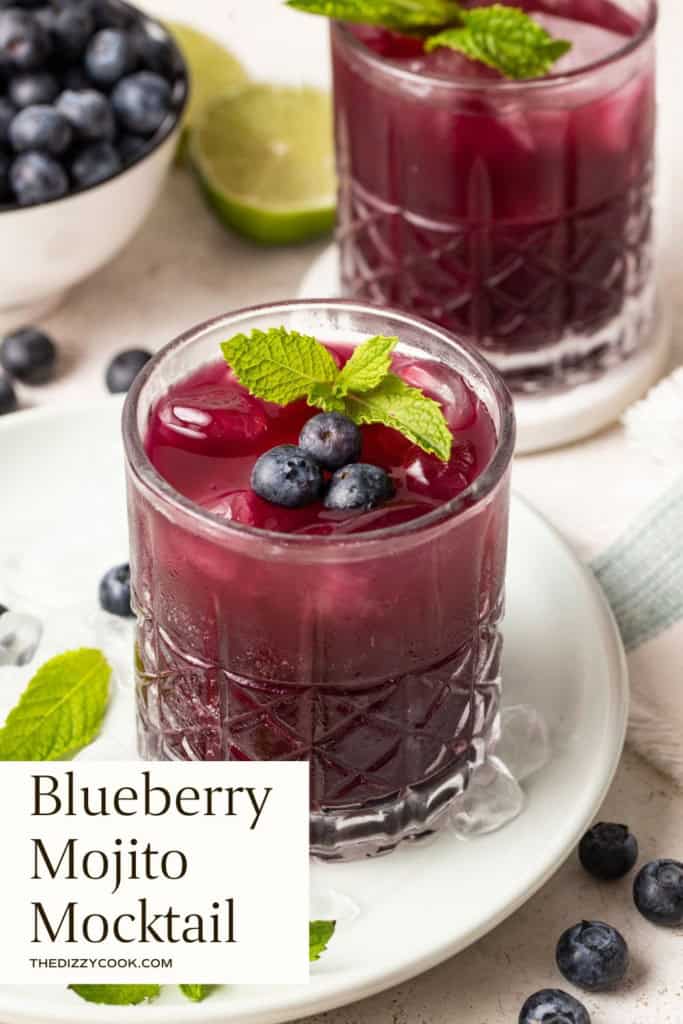 Blueberry mojito mocktail in a short glass.