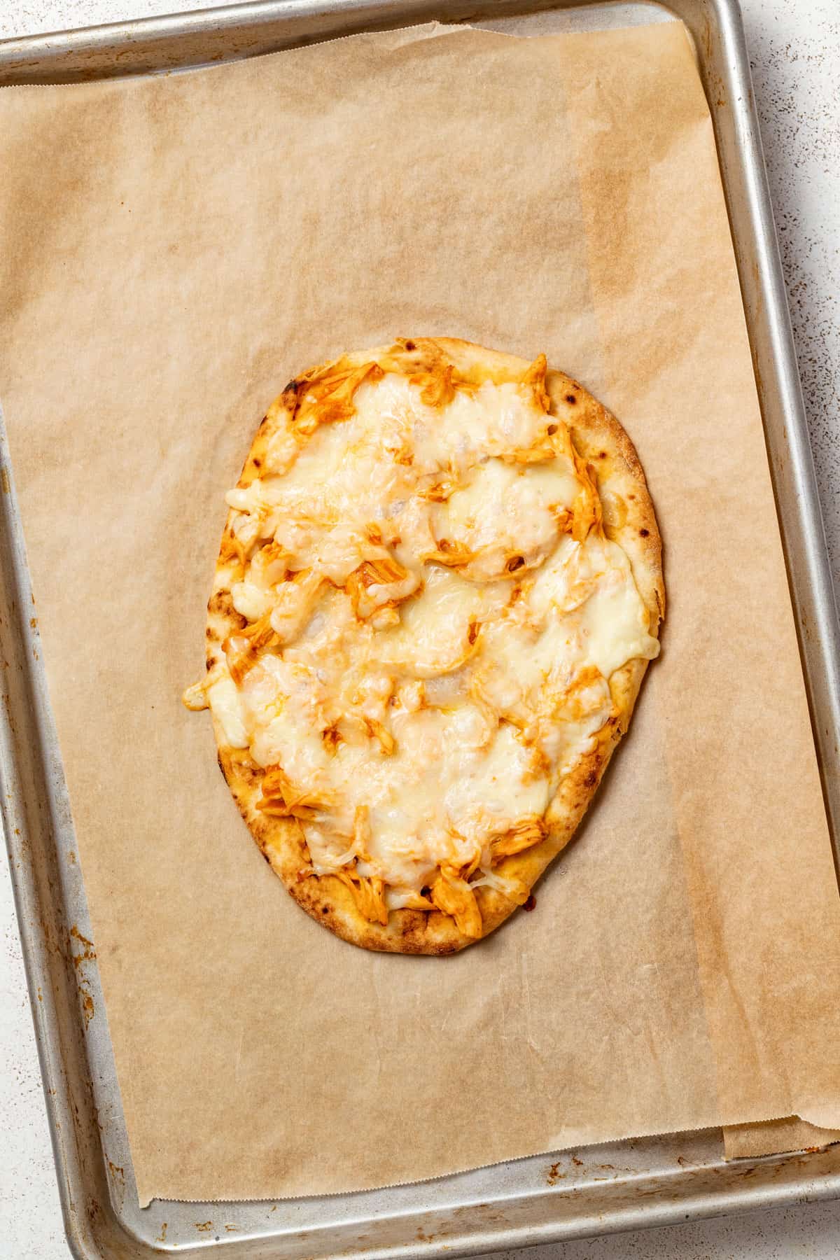 Flatbread with buffalo chicken after being baked.