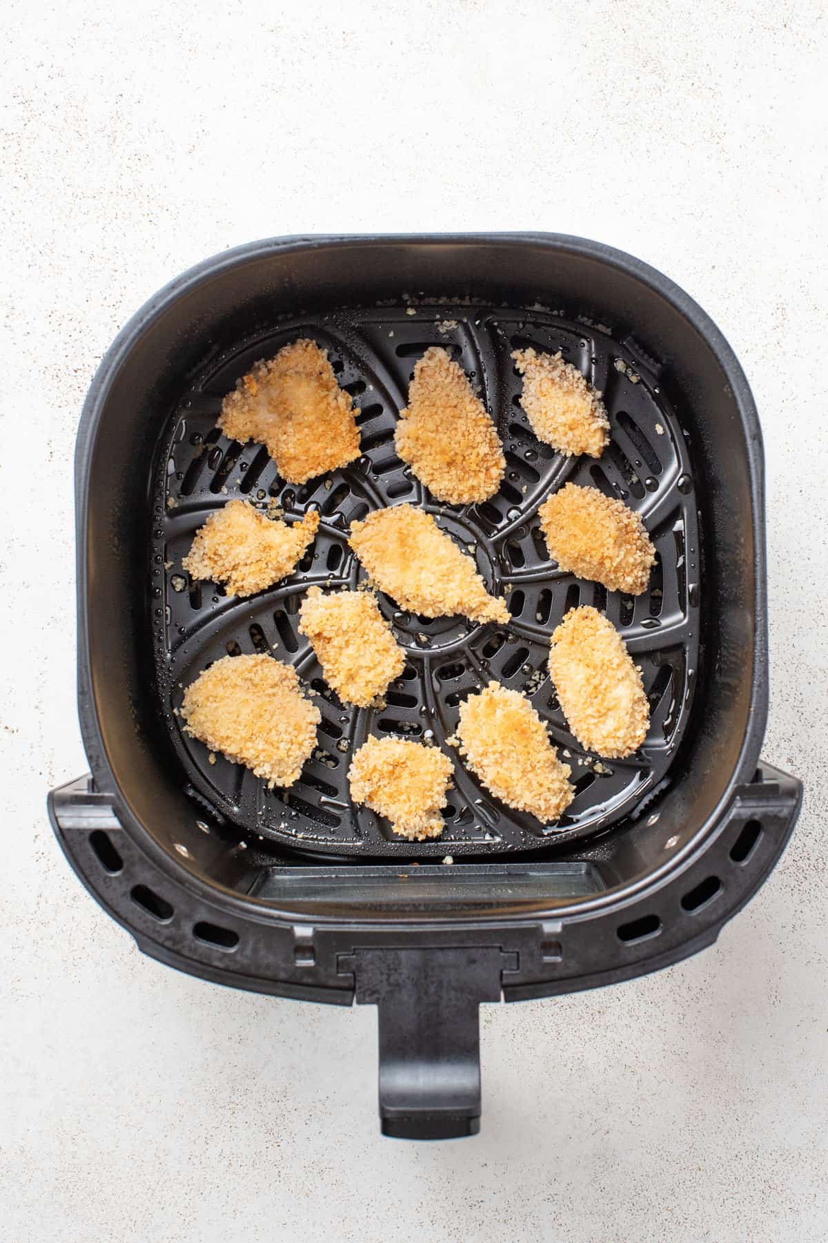 Chicken nuggets after cooking in the air fryer until golden brown.