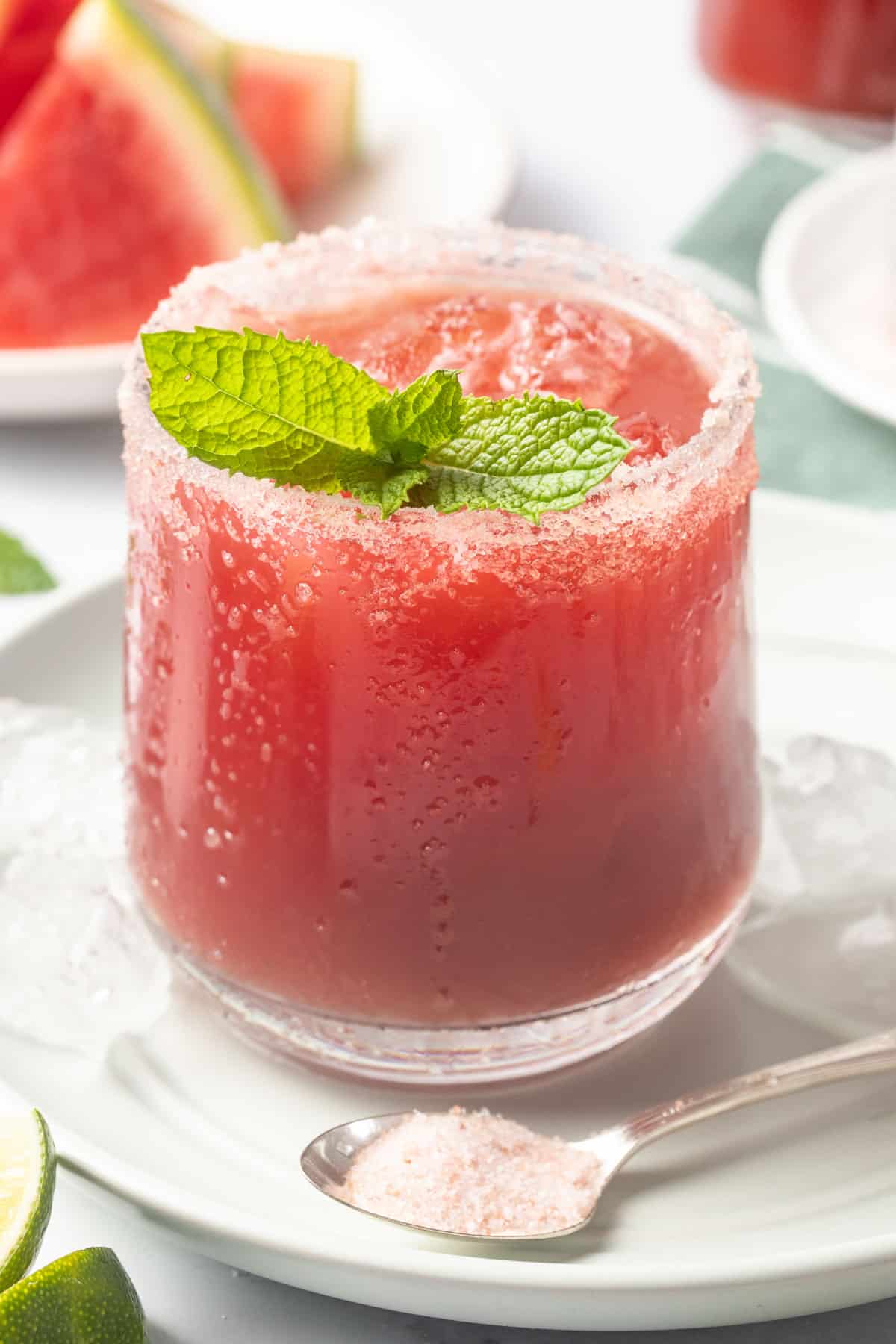 Watermelon mocktail with mint and salt around the rim of the glass.