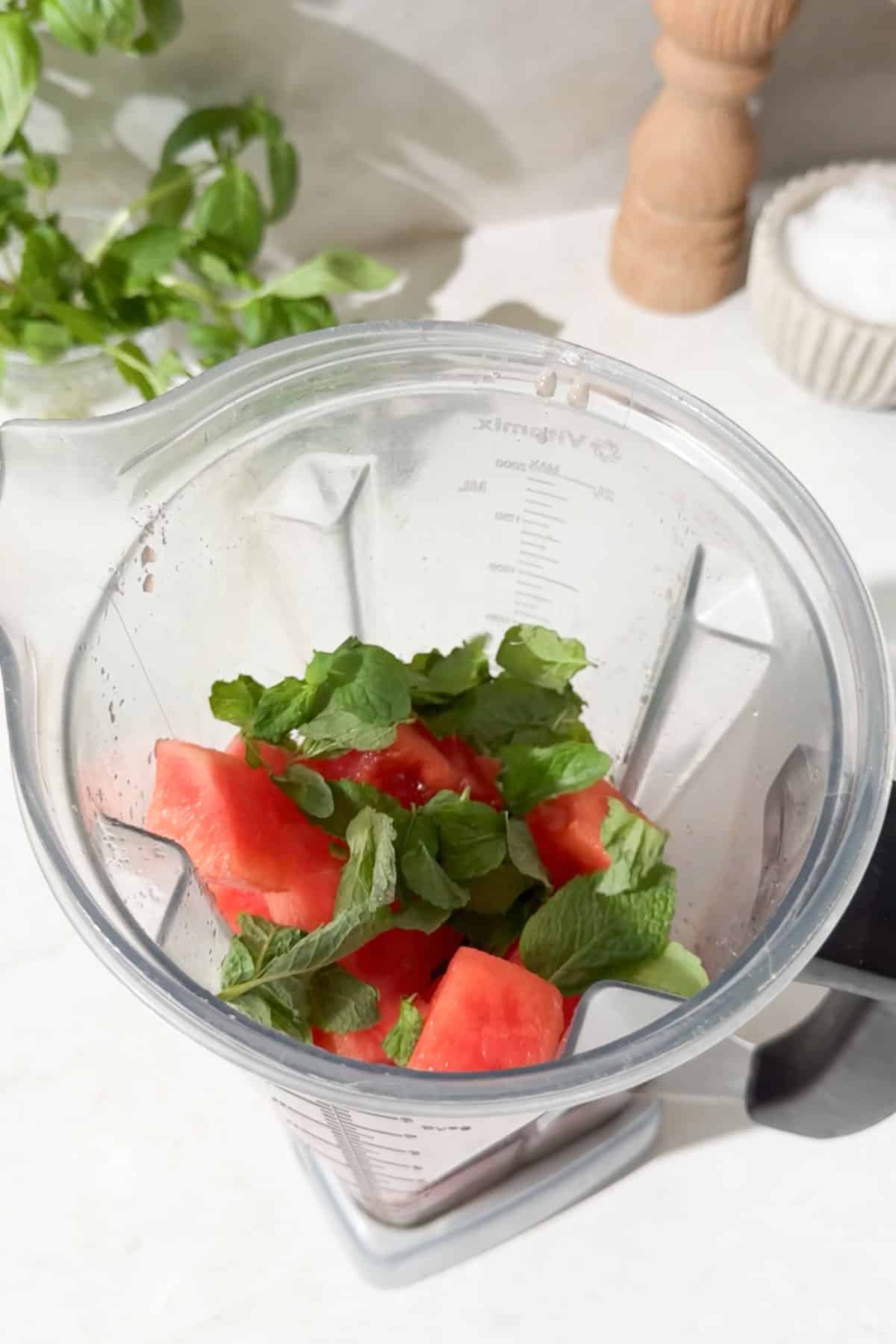 Watermelon and fresh mint combined in a blender.