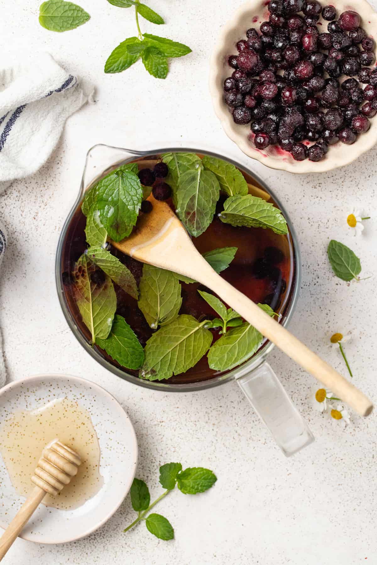 Infusing in the wild blueberries into the tea.