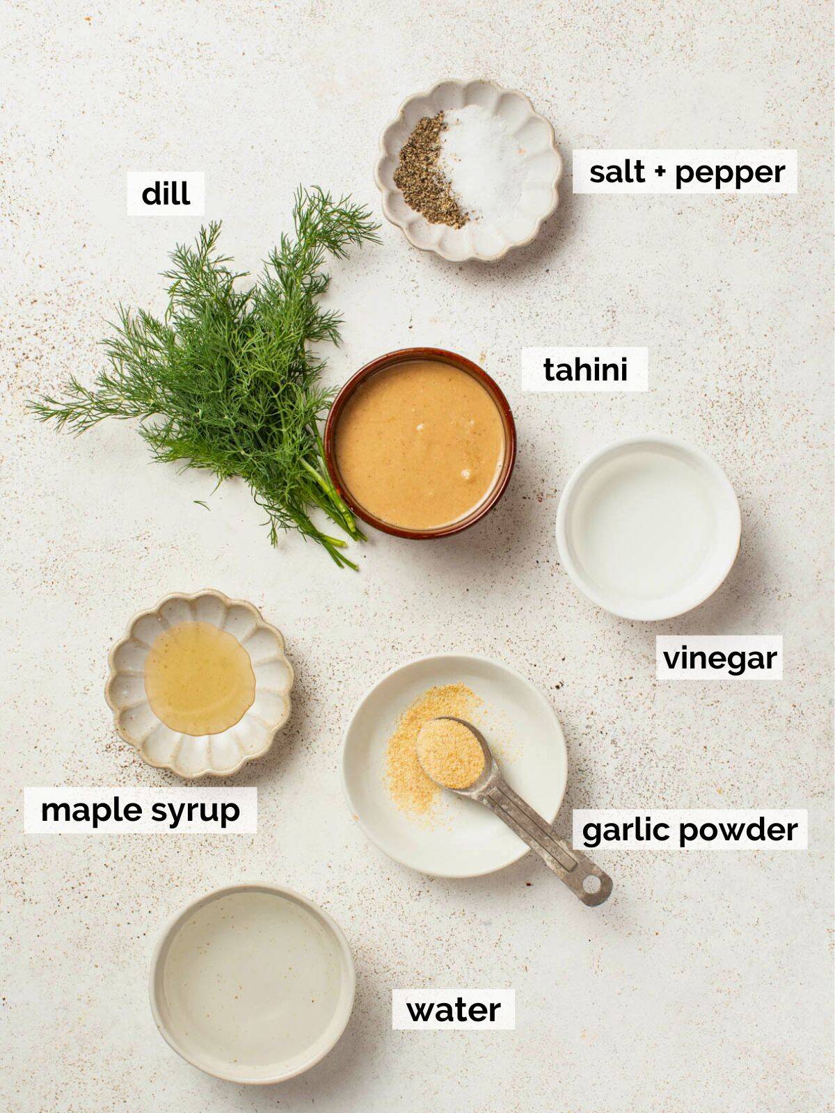 Ingredients for an easy tahini sauce with dill and garlic.