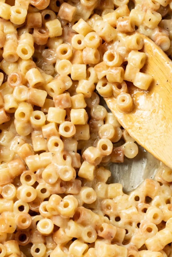Butter pasta on a wood spoon.