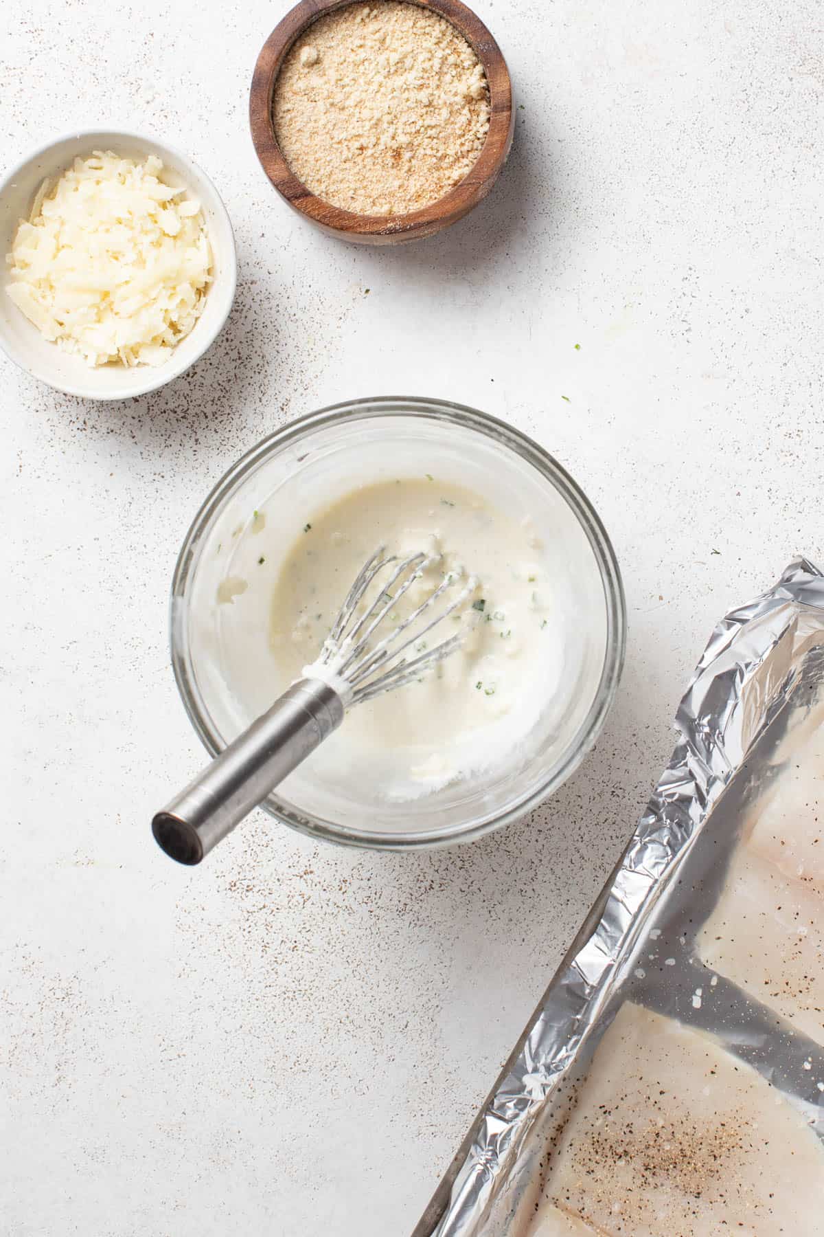 Whisking together the mayonnaise mixture.