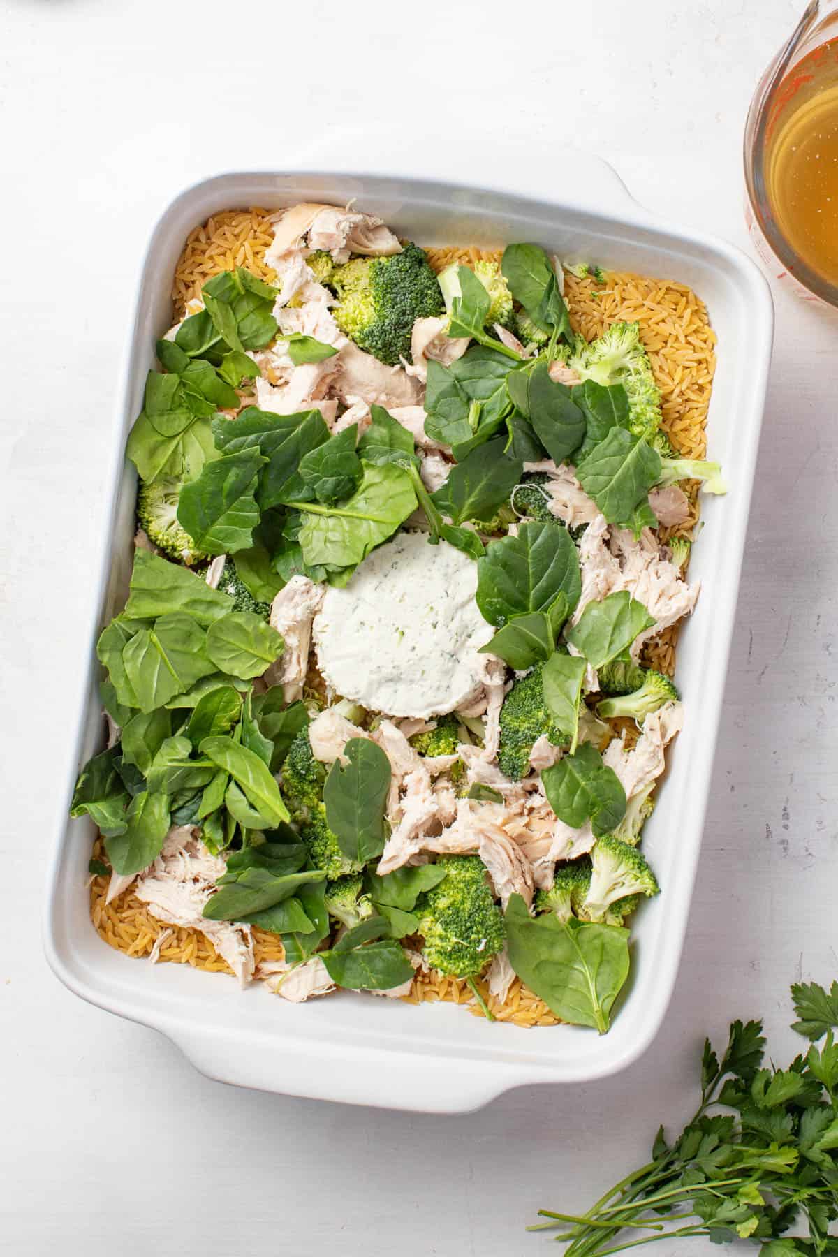 All the ingredients in a baking dish without the broth. 