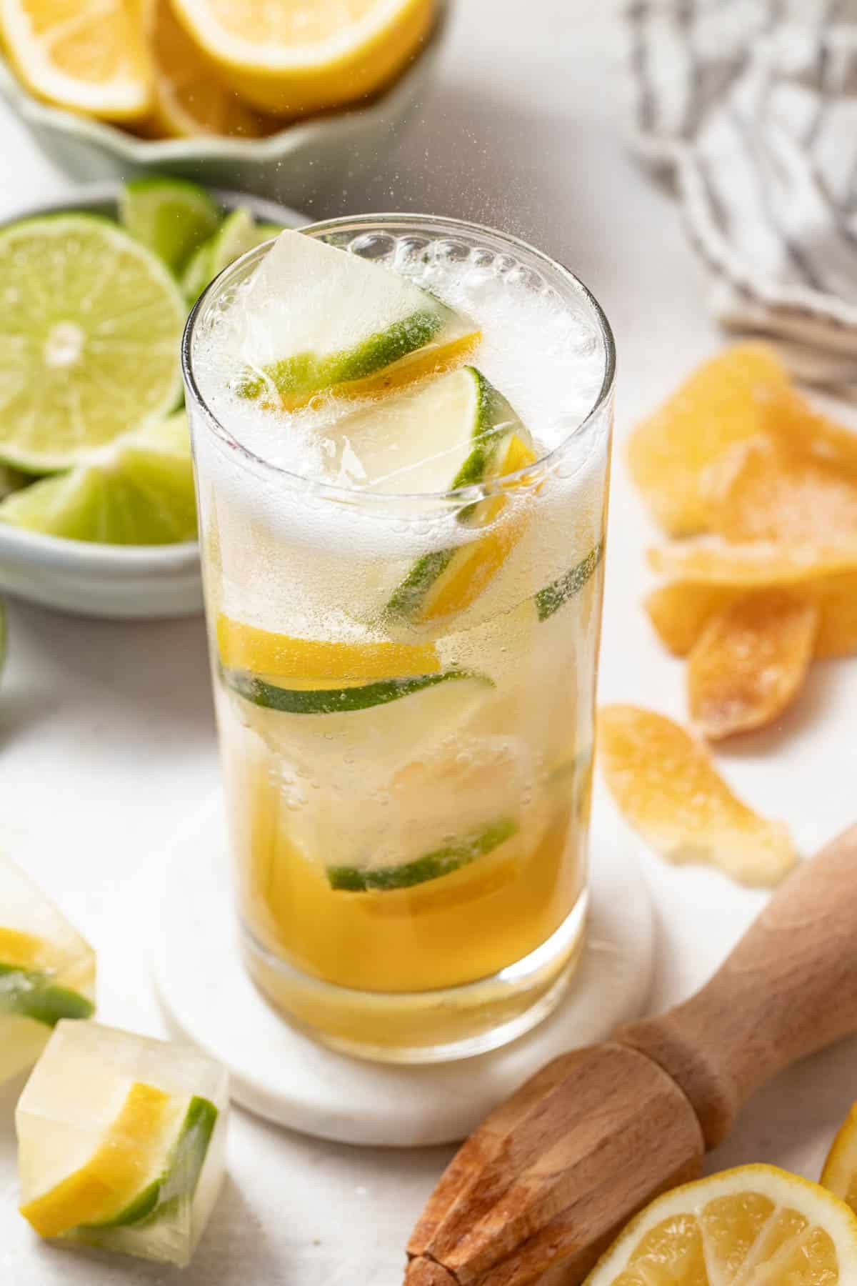 Adding sparkling water to the lemon lime soda mixture.