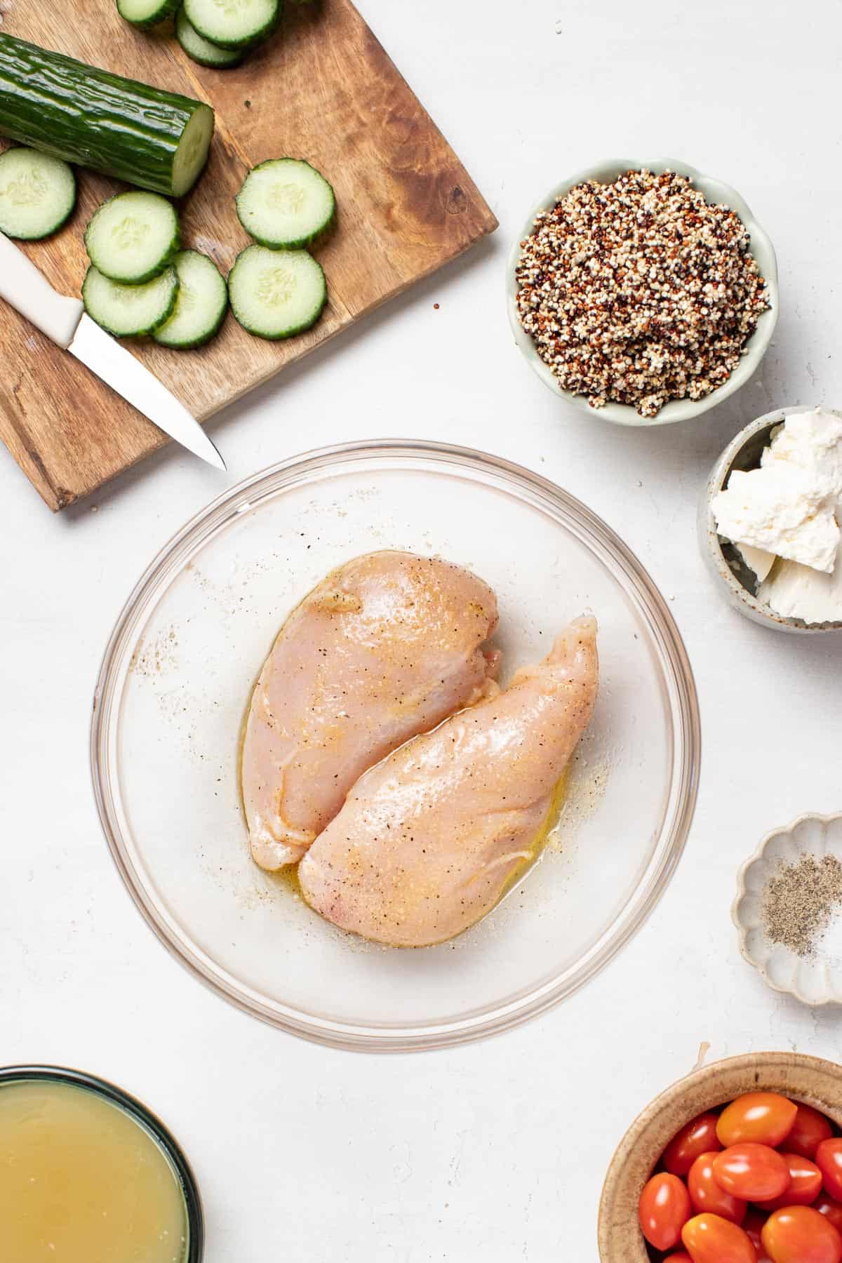Thin sliced chicken breasts in a seasoning mixture.