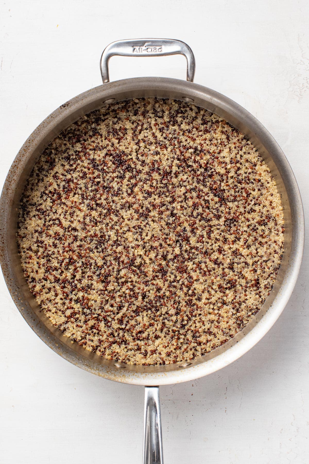 Cooked quinoa in a pan.