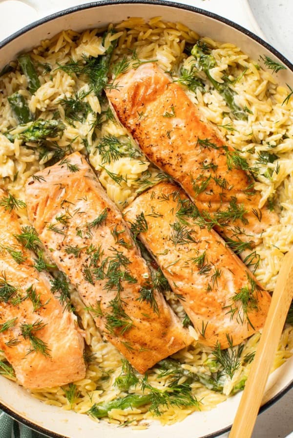 Salmon in a creamy orzo with fresh asparagus and herbs.