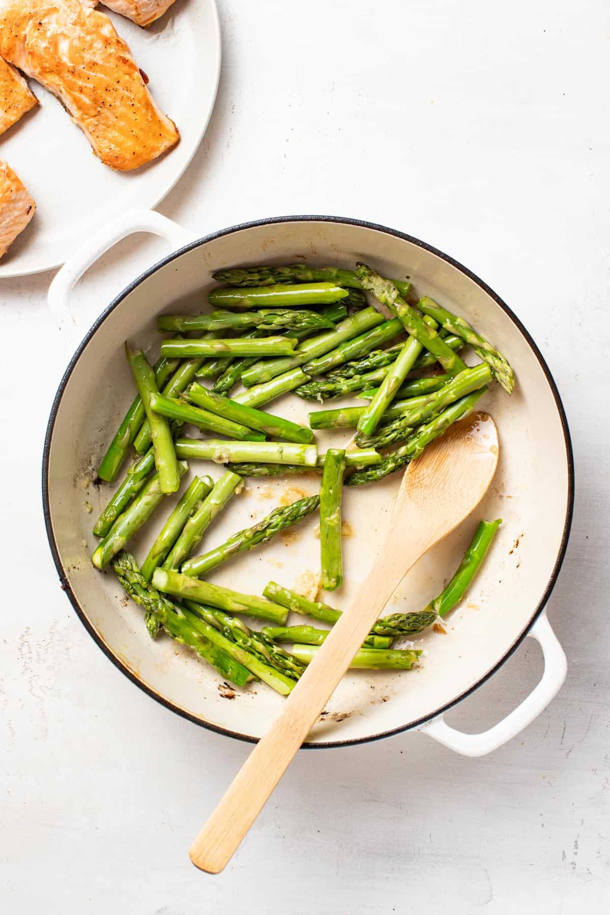 Cooking asparagus in a pan.