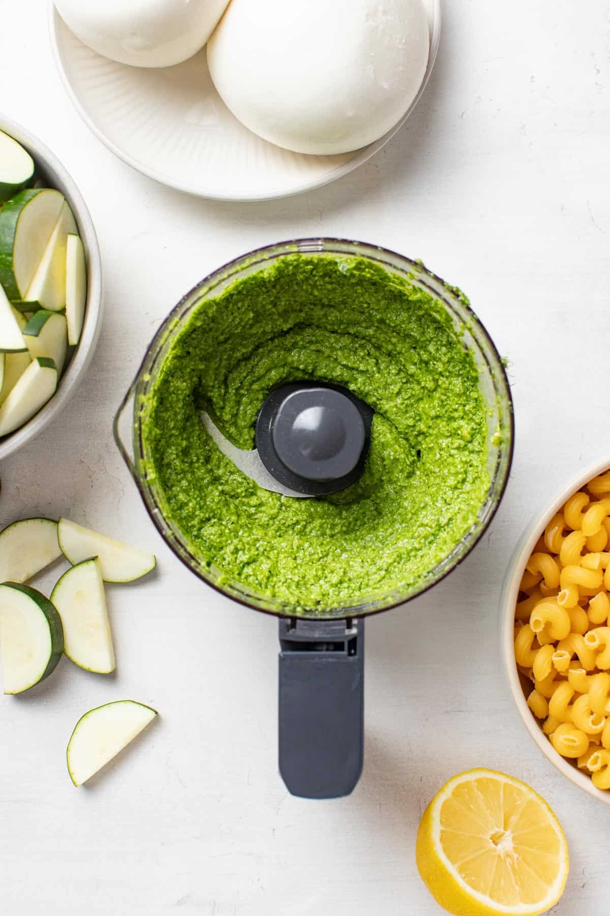 Blended pesto in a food processor.