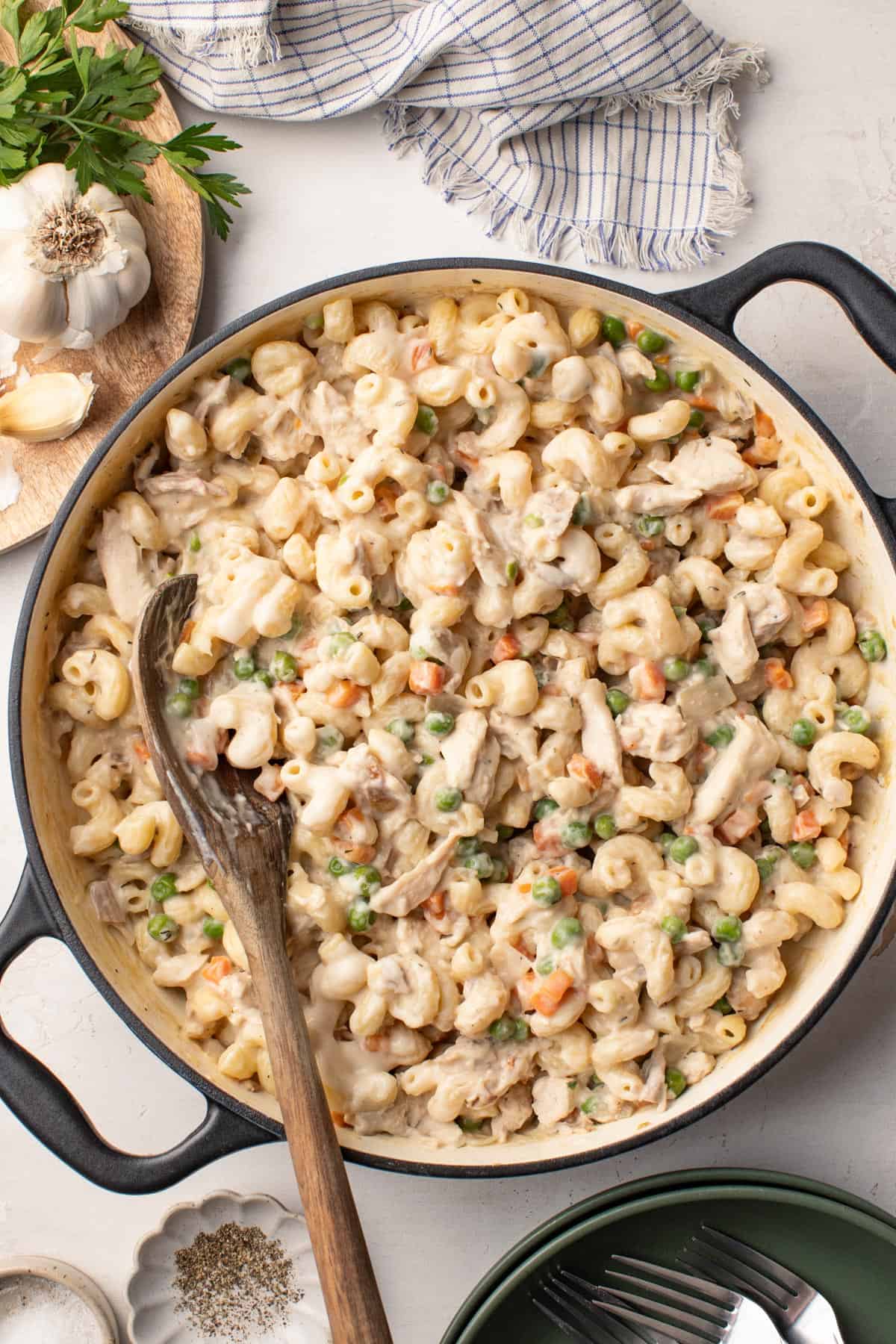 Rotisserie chicken stirred into a big pot of creamy pot pie pasta.